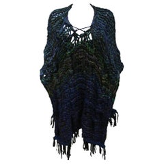Oversized hand made knitted poncho/vest with leather fringing, c. 1970s