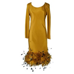 Cocktail dress in  ochre silk and cock feathers