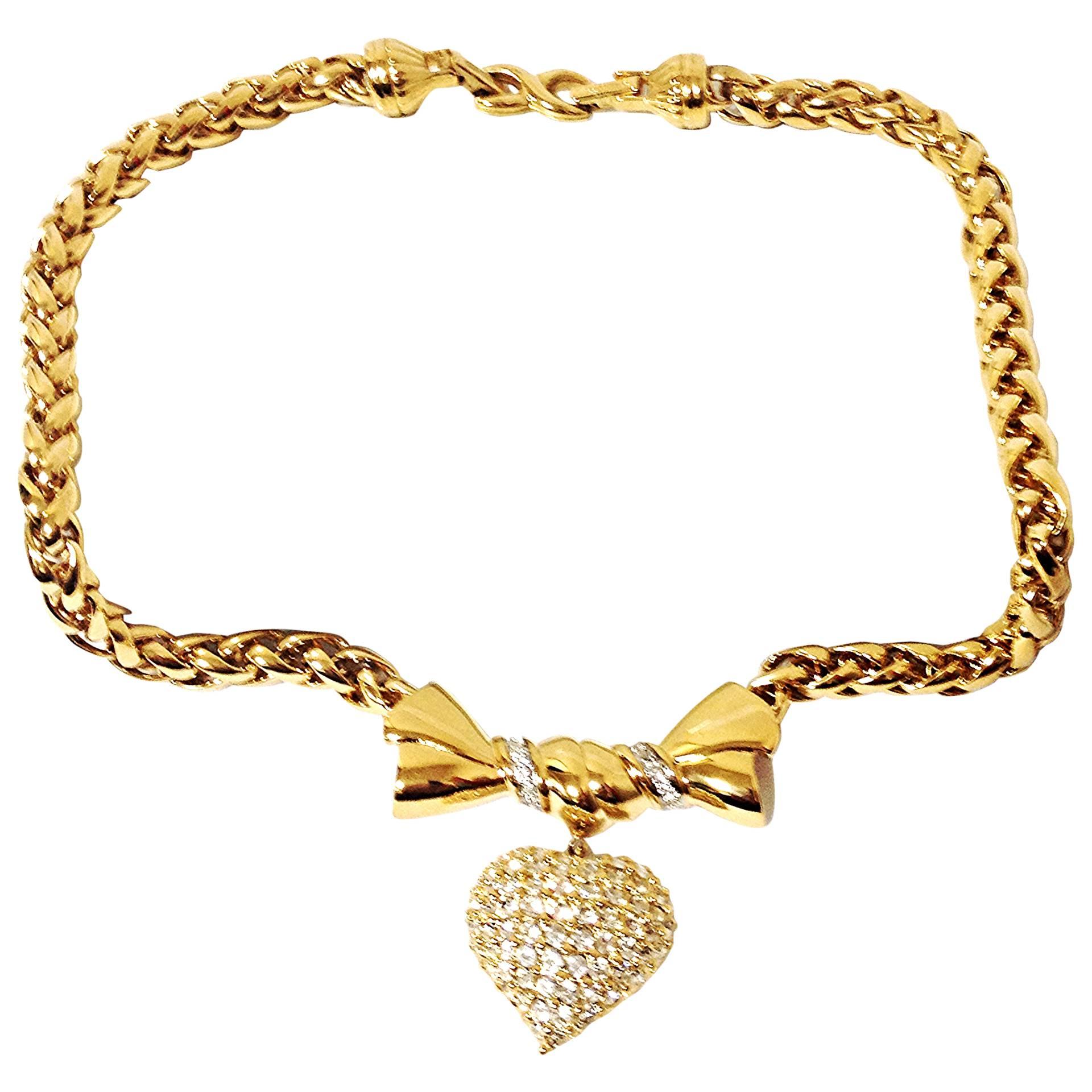 MINT. Vintage Nina RIcci golden chain statement necklace with bow and heart top For Sale