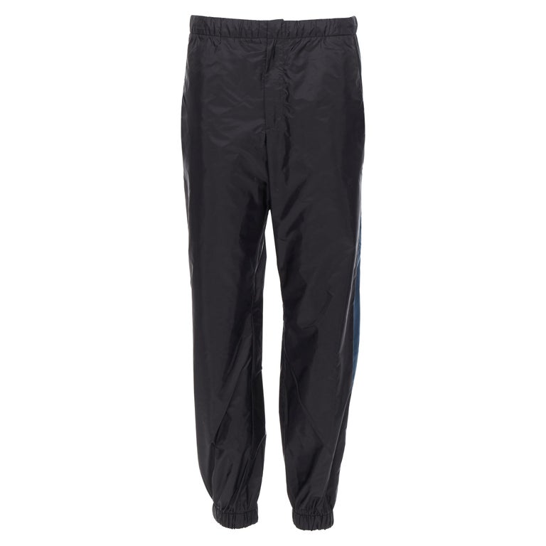 new PRADA Nylon 2018 black blue side stripe toggle gabardine track trousers  L For Sale at 1stDibs | prada gabardine pants, prada gabardine track pants, prada  track pants
