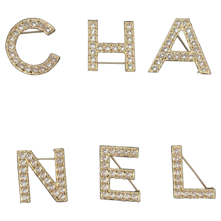 CHANEL 2019 Strass Logo Letters Brooch Set NEW With Tags For Sale at  1stDibs | chanel letters, chanel letter brooch, chanel brooch