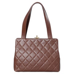 Brown leather padded bag Chanel ( numbered)