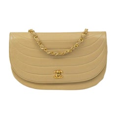 CHANEL, Vintage Demi Lune in beige leather 