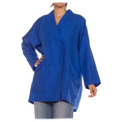 Giacca Gucci anni '80 in poliestere blu con logo e cappuccio staccabile