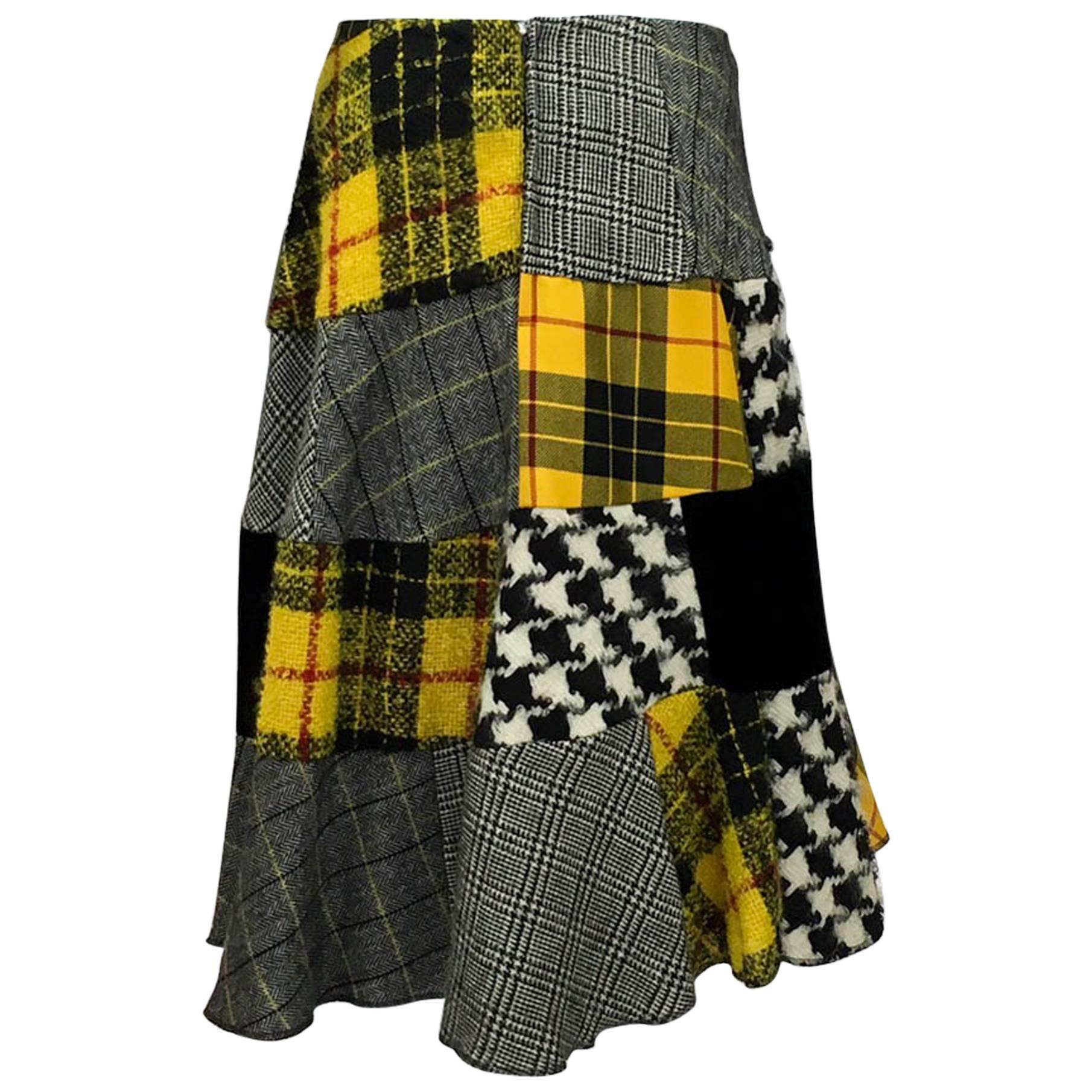Rare Vintage Comme des Garcons Patchwork Asymmetrical Skirt. Fabulous skirt by Comme des Garcons featuring patch work in plaids, tweeds, mohair and black velvet. This asymmetrical skirt flares out creating a very flattering silhouette. Back zipper.