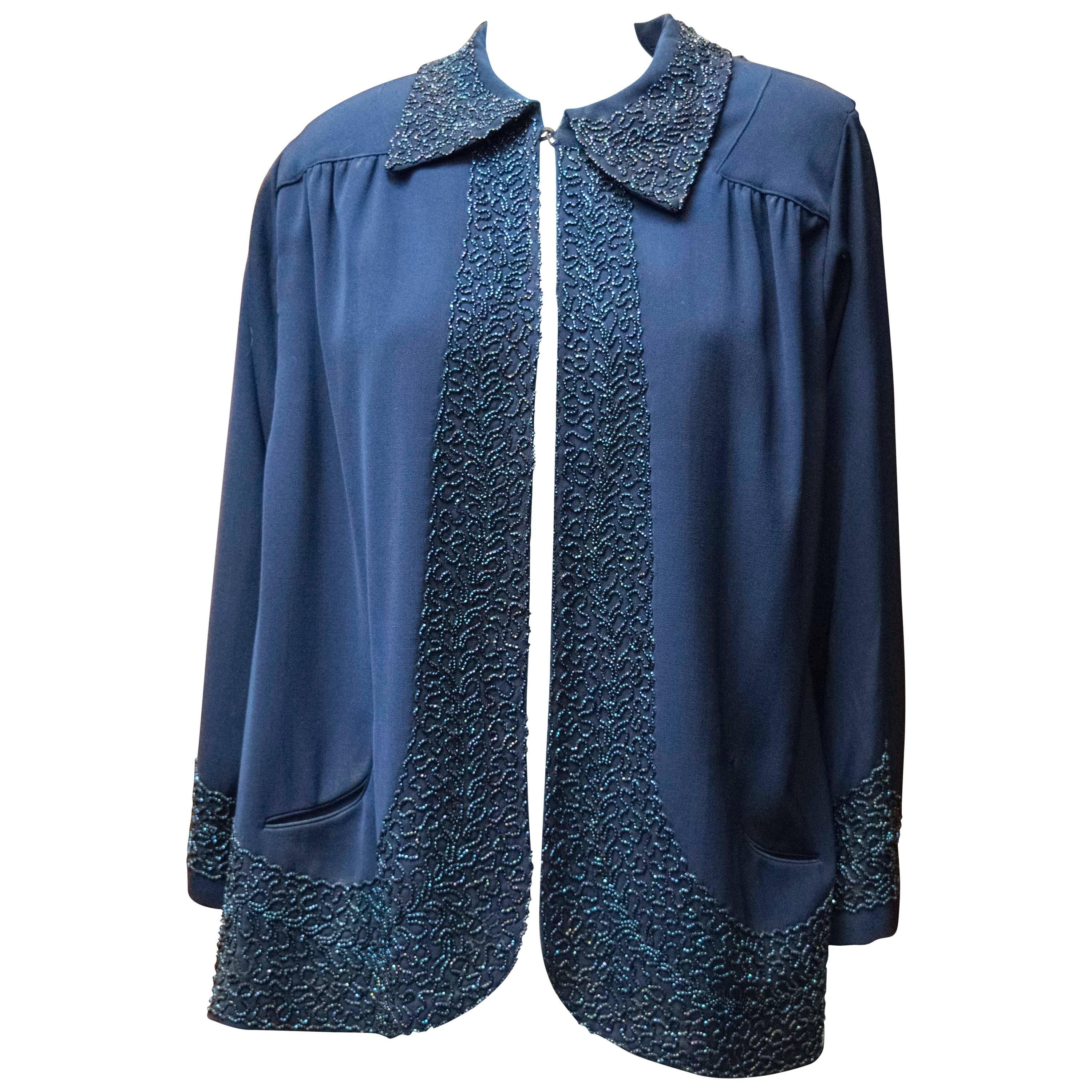 Veste perlée bleu marine des années 1940