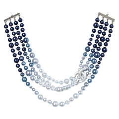 Multi-strand neckless in a blue shading and "Double CC"  brand Chanel 