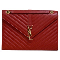 SAINT LAURENT, Enveloppe in red leather