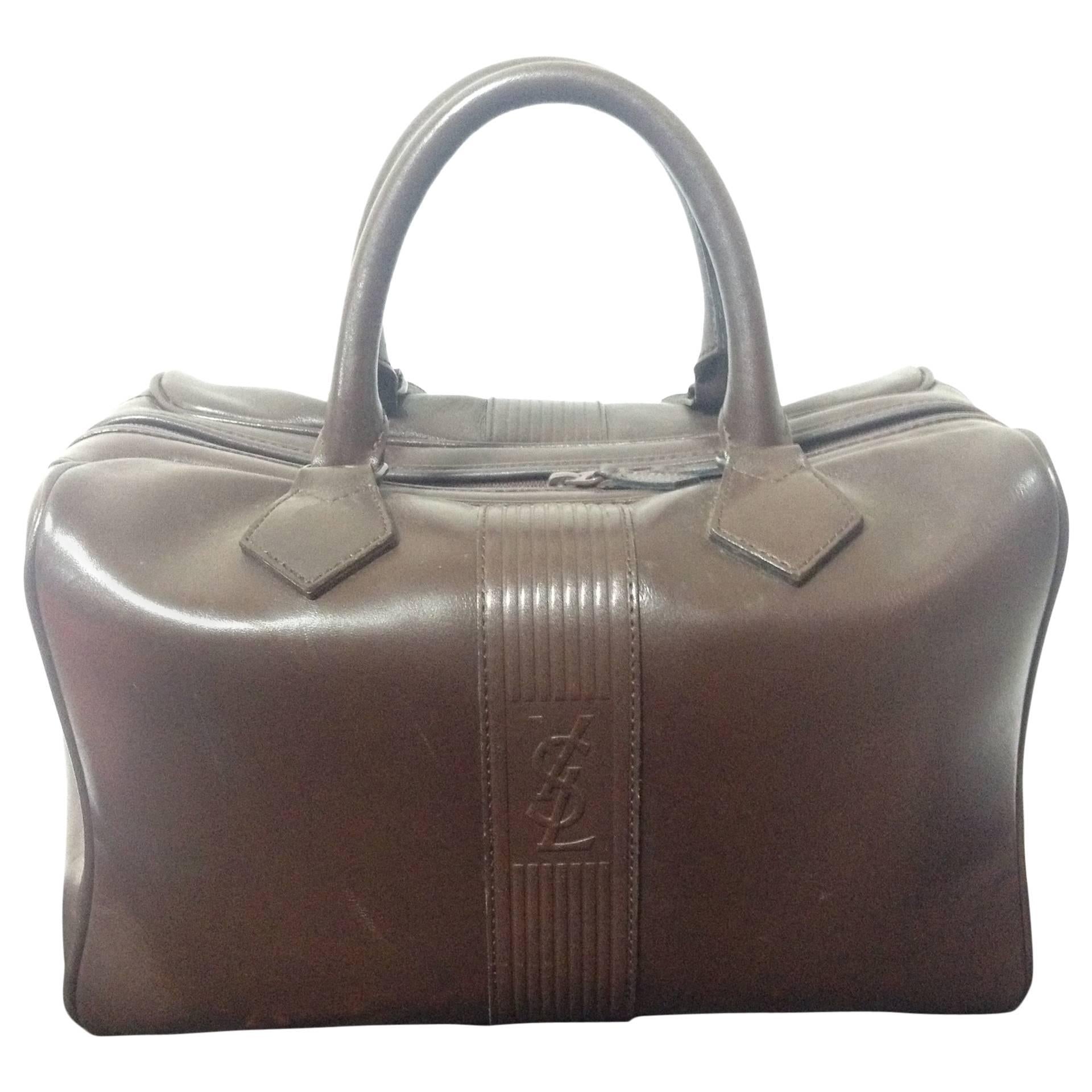 Vintage Yves Saint Laurent genuine dark brown leather daily use duffle bag. Clas For Sale
