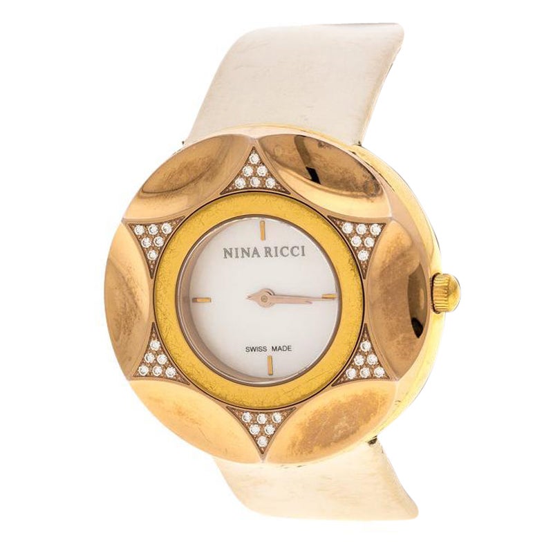 Nina Ricci Montre-bracelet pour femme en acier plaqué or et nacre blanche,  36 mm En vente sur 1stDibs