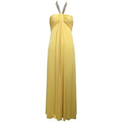 1970s Victoria Royal yellow jersey halter gown with jeweled neckline