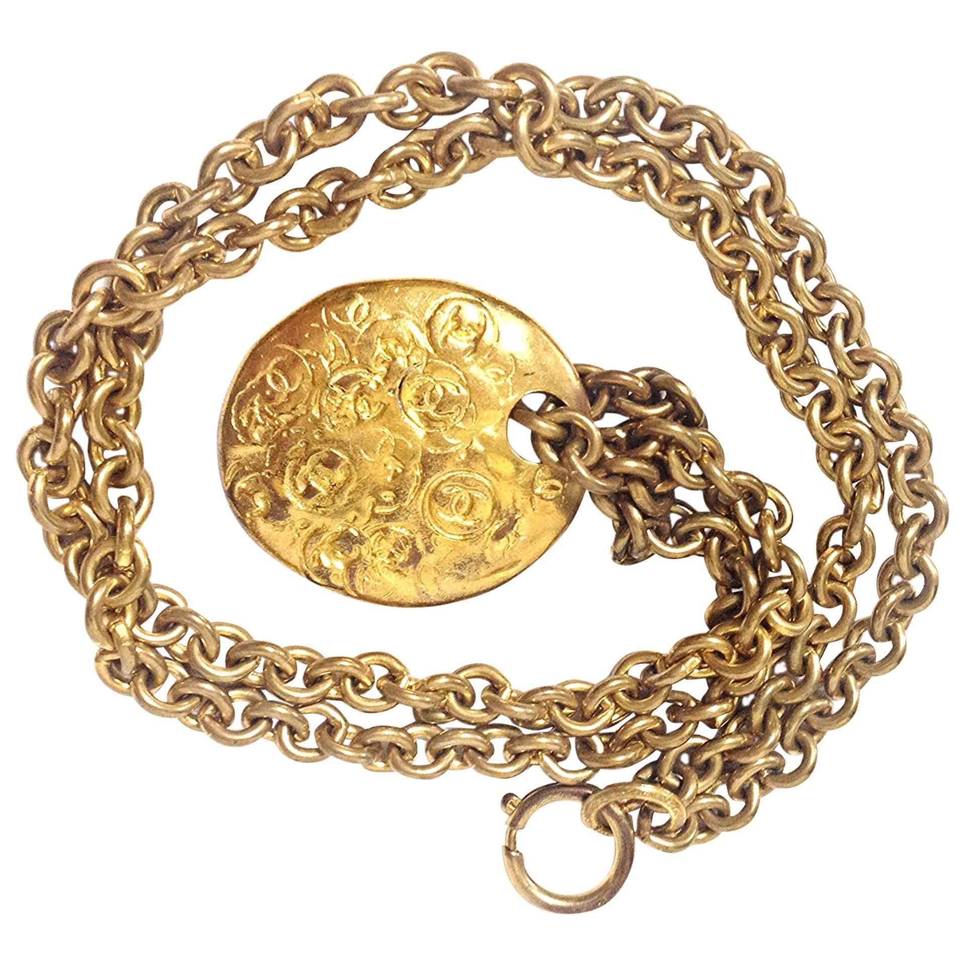 Vintage CHANEL gold tone long chain necklace with a round coin, medal cc top For Sale