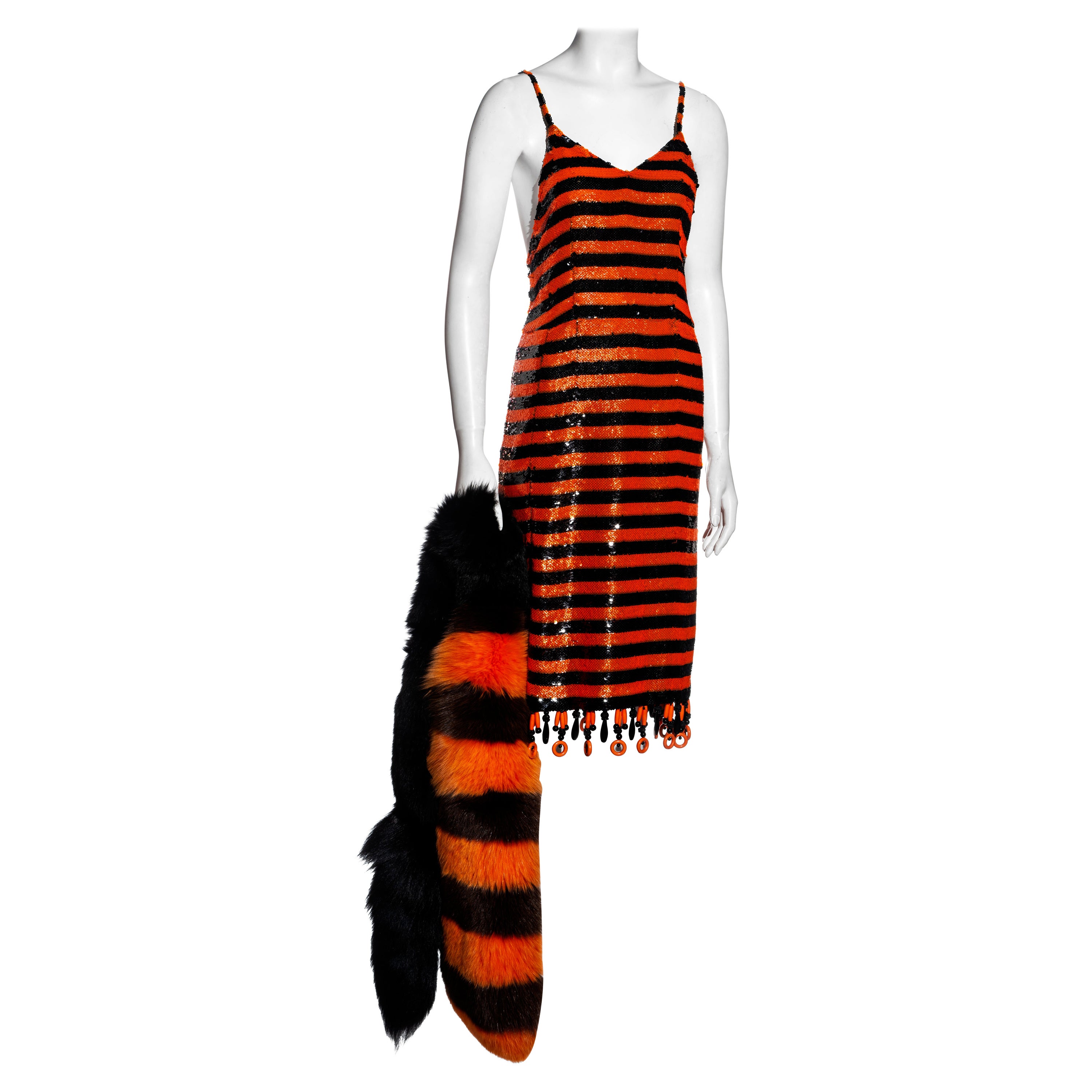 Prada orange and black striped sequin flapper dress and fox fur stole, ss 2011