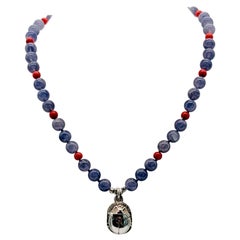 A.Jeschel Sterling silver Scarab supended from an Iolite and coral necklace