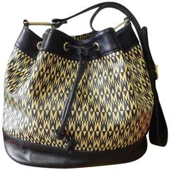 Vintage MOSCHINO black and ivory logo print hobo bucket shoulder bag.