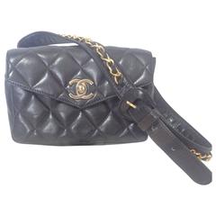 Vintage CHANEL black leather waist purse, fanny bag with golden chain belt.