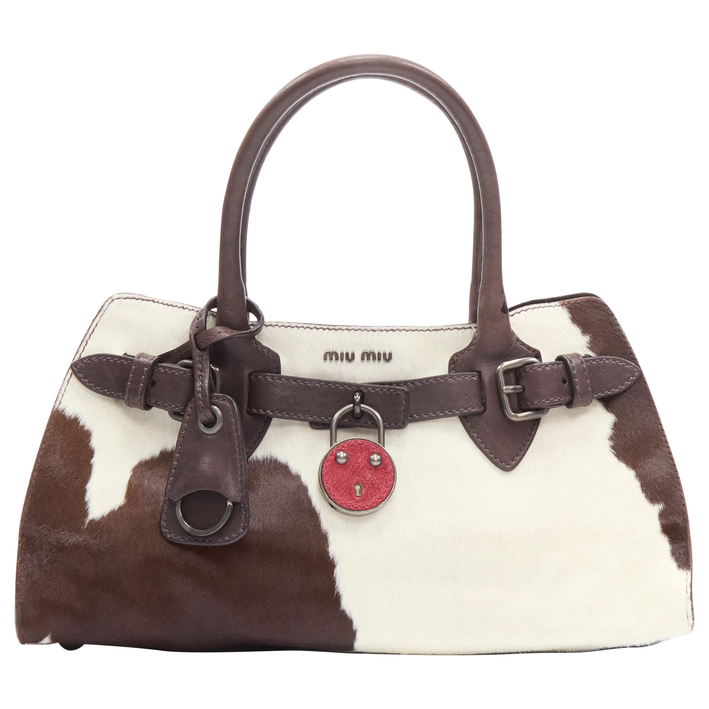 vintage MIU MIU brown white cow print horse half red lock satchel bag at  1stDibs
