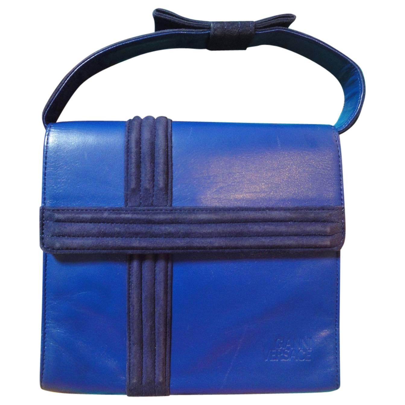 Vintage Gianni Versace blue smooth and suede leather handbag purse with a bow. 