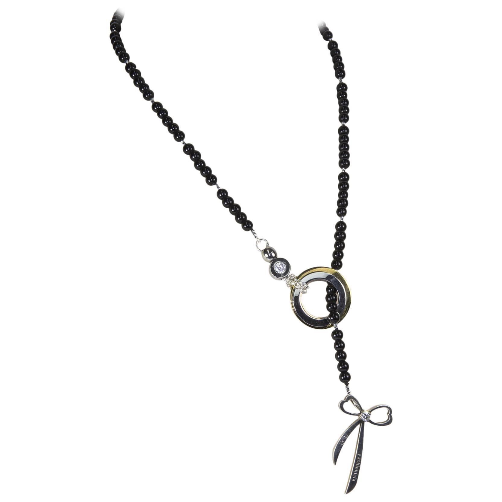 Halskette aus Edelstahl mit Herzanmerkung aus Sterlingsilber und Onyx im Angebot