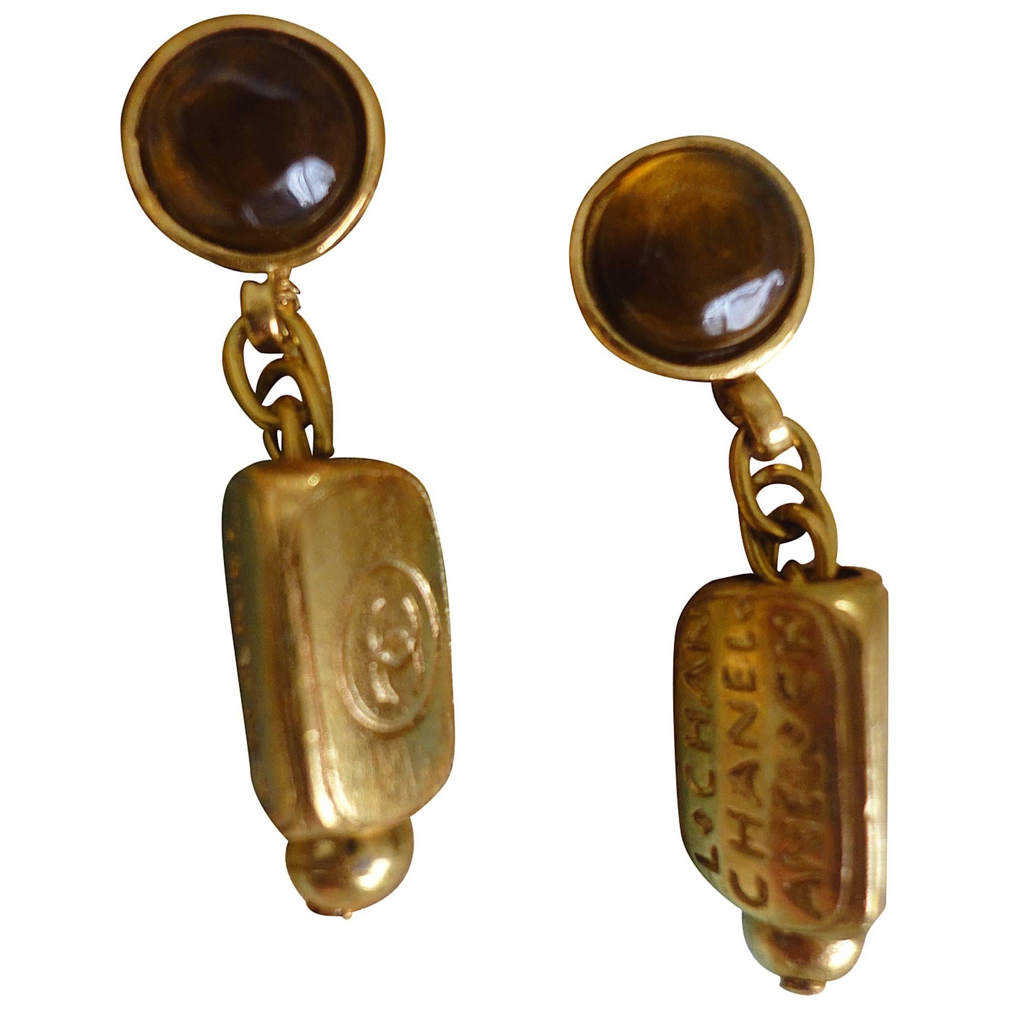 Vintage CHANEL golden dangling stud, pierced earrings with round brown gripoix