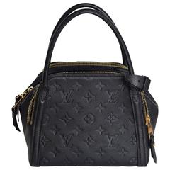 This is an authentic Brand NEW - Never worn LOUIS VUITTON Monogram Empreinte Mar