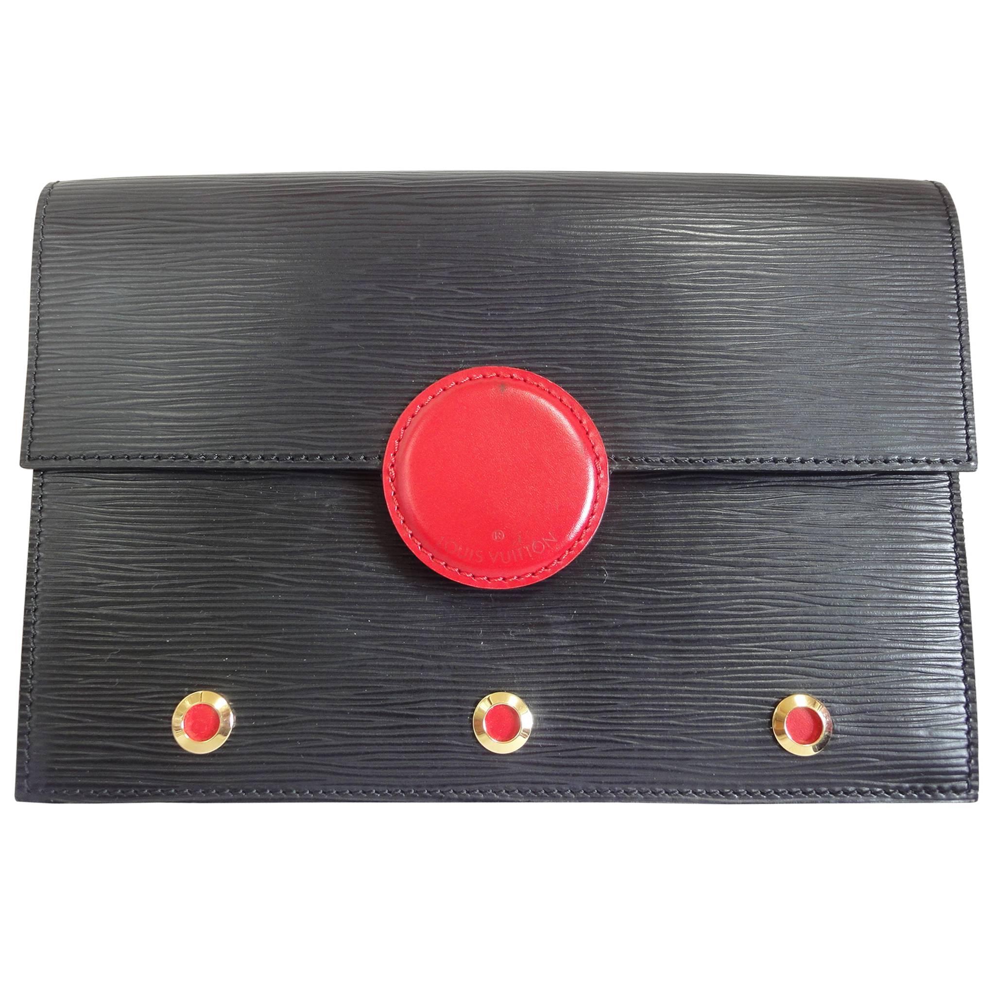 Vintage Louis Vuitton black epi mod clutch, shoulder bag with a red eye hublot. For Sale