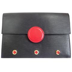 Retro Louis Vuitton black epi mod clutch, shoulder bag with a red eye hublot.