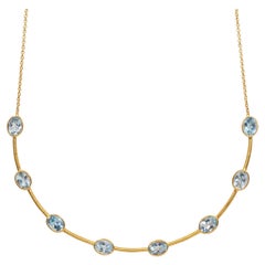 Collier ras du cou April in Paris Designs en or, vermeil et topaze bleue 