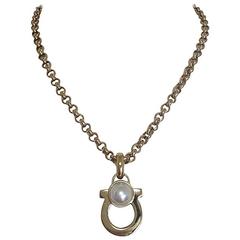 Vintage Salvatore Ferragamo white faux pearl and golden gancini necklace.