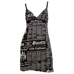 John Galliano “Gazette” newspaper print dress