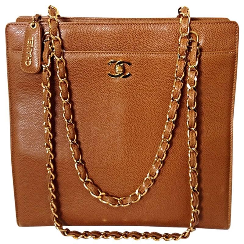 1990s. Vintage CHANEL camel brown caviar leather square shoulder tote bag.