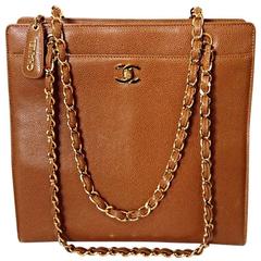 1990s. Vintage CHANEL camel brown caviar leather square shoulder tote bag.