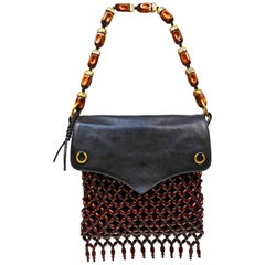 Yves Saint Laurent black suede and leather bag with fringed wood beading