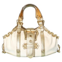 Canvas and gold leather hand-bag with belt and buckle Louis Vuitton "Inventeur"