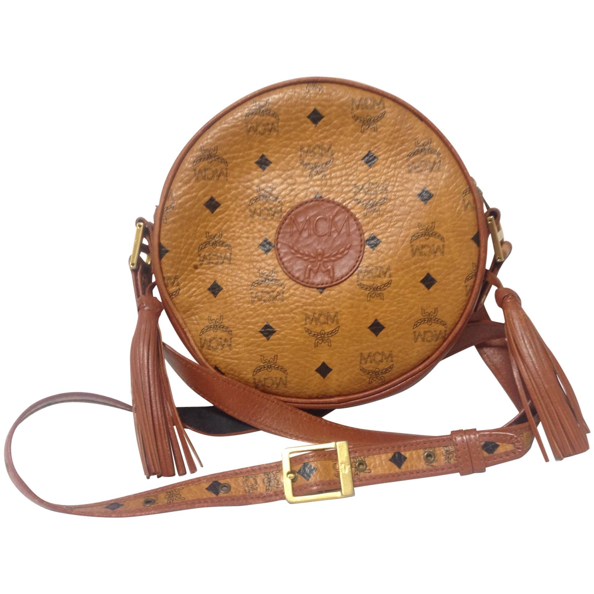 Vintage MCM brown monogram round shape shoulder bag with fringe. Michael Cromer
