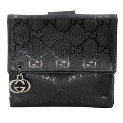 Gucci Mini portefeuille à rabat en toile GG enduite GG-0317N-0069