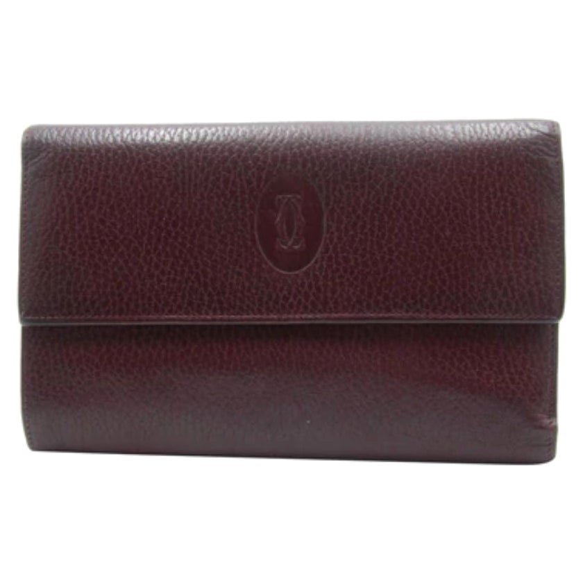 Cartier Burgundy Pebbled Leather Logo Tri-Fold Continental Wallet CR-W0930P-0405 For Sale