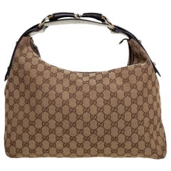 Gucci Hobo marrone con morsetto in tela Guccissima