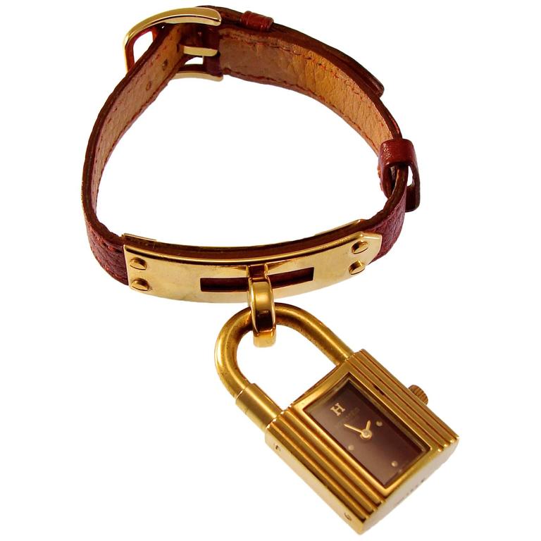 Elegant Hermes Paris Gold Kelly Watch with Red Face + Rouge H Leather Strap 90s at 1stDibs