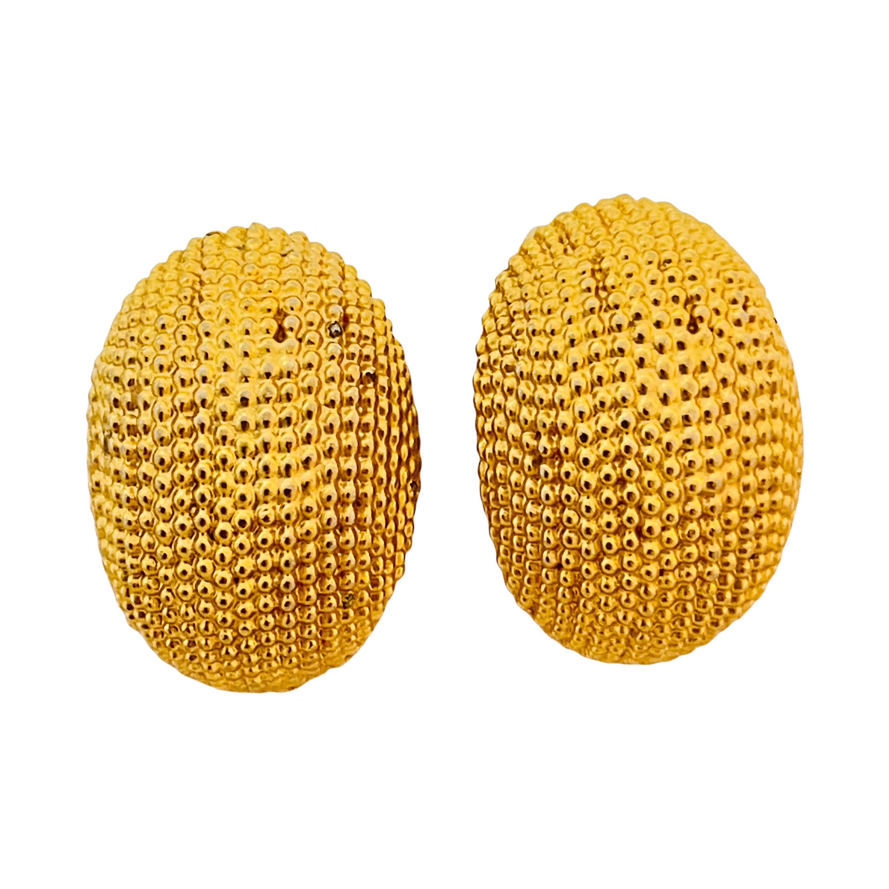 Vintage gold textured designer runway clip on earrings For Sale