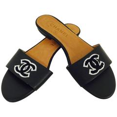 Chanel Black Leather Slides With Embroidered Double C Logo