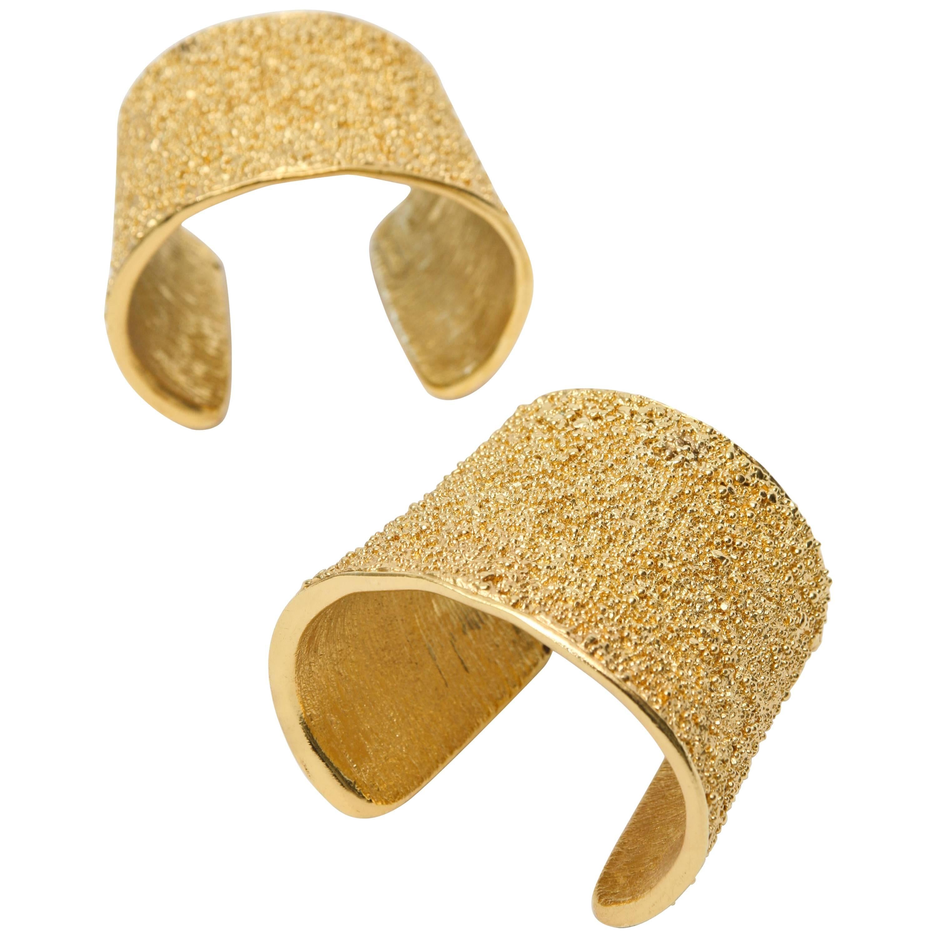 Pair of Signed Yves Saint Laurent Textural Gold Plated Cuff Bracelets