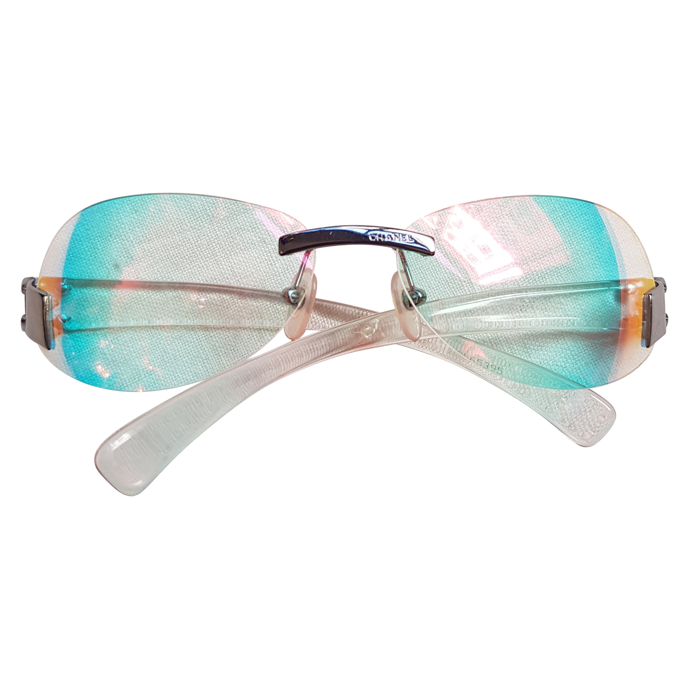 CHANEL clear holographic multi color tinted CC silver rimless Sunglasses 