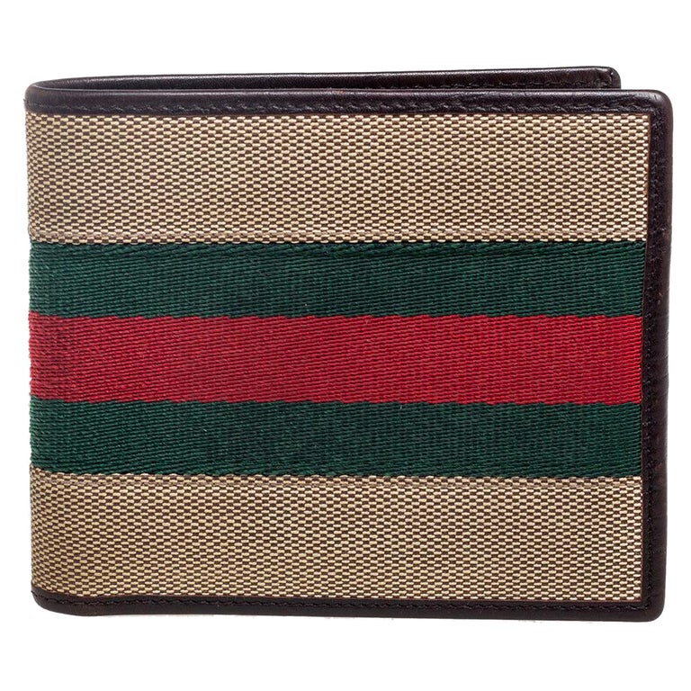 Gucci Brieftasche aus braunem Leder und Segeltuch mit Webklappe im Angebot  bei 1stDibs