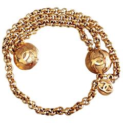 Vintage CHANEL golden double chain belt with two large CC round motif charms.