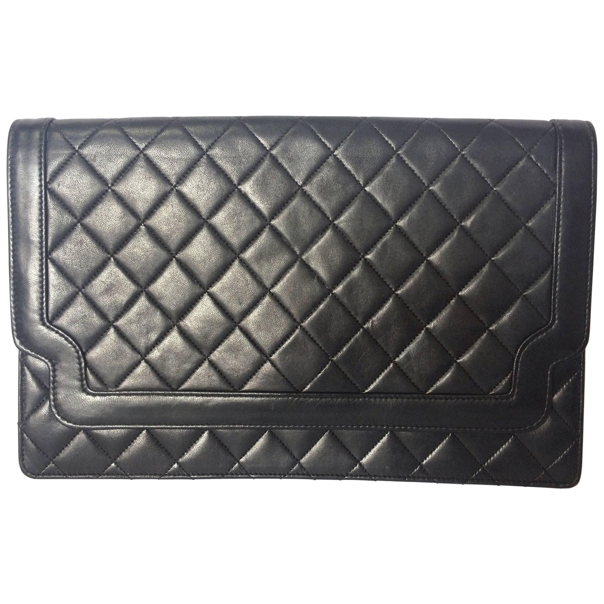 Vintage CHANEL classic black quilted lambskin document clutch purse. Classic bag