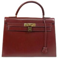 1980s Vintage HERMES Kelly 32 bag rouge ash box calf leather. Red, brown.
