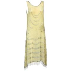 1920s yellow silk and silver beaded flapper dress