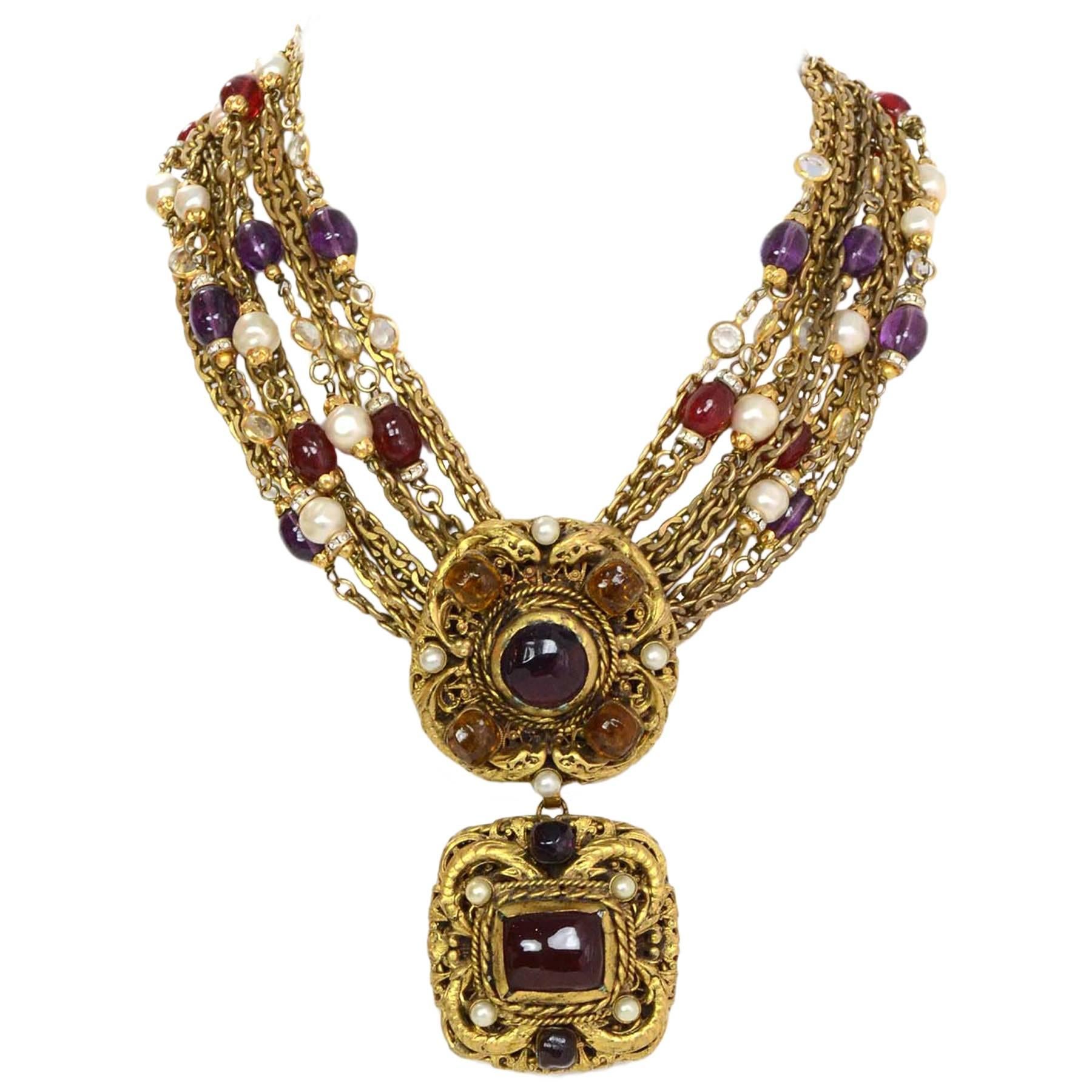 Chanel Vintage '84 Multi-Strand Gripoix & Pearl Medallion Necklace 
Features three detachable medallions gripoix and pearls

Made In: France
Year of Production: 1984
Color: Goldtone, red, purple, orange and ivory
Materials: Metal, poured class, faux