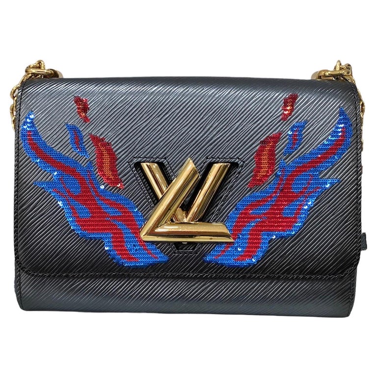Louis Vuitton. Lv woman twist MM epi leather mix gold silver chain